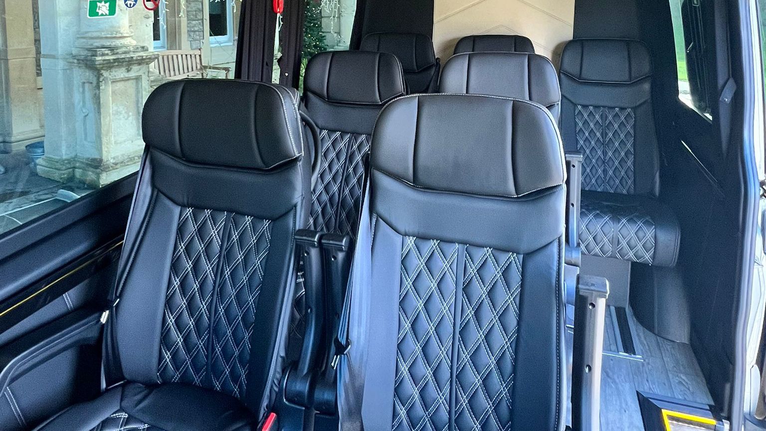 Black leather seats inside Mercedes Minibus