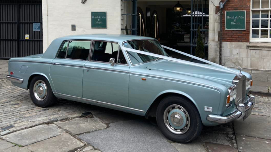 Rolls-Royce Silver Shadow dressed with white ribbons parked in the street of Bristol