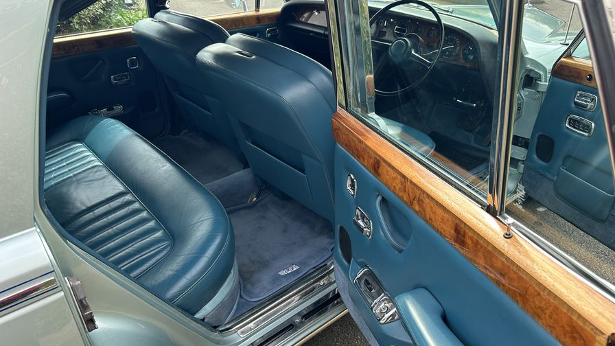 rear interior blue leather inside classic Rolls-Royce with blue carpet