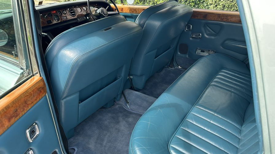 Rolls-Royce Silver Shadow rear interior blue leather seats with wooden panels on top of the door cards