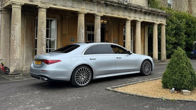 Rear right view of Silver Mercedes S-Class parked in front of wedding venue in Bristol