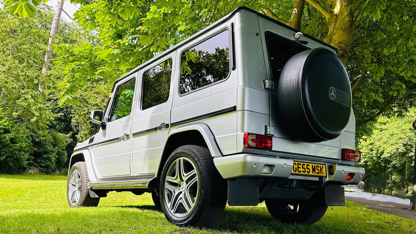 Rear side view of Mercedes G-Wagon with spare wheel attached to the rear of the vehicle