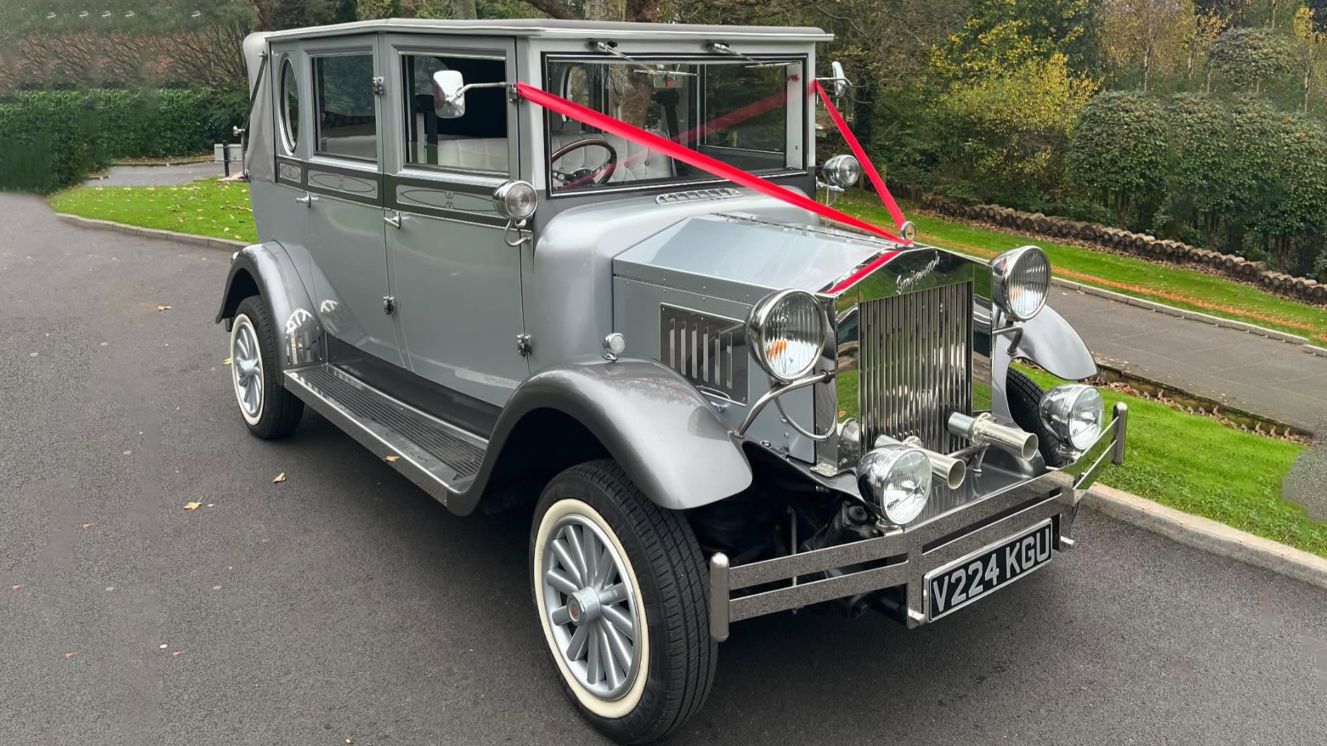 Vintage Imperial in silver with red wedding ribbons and white wall tires