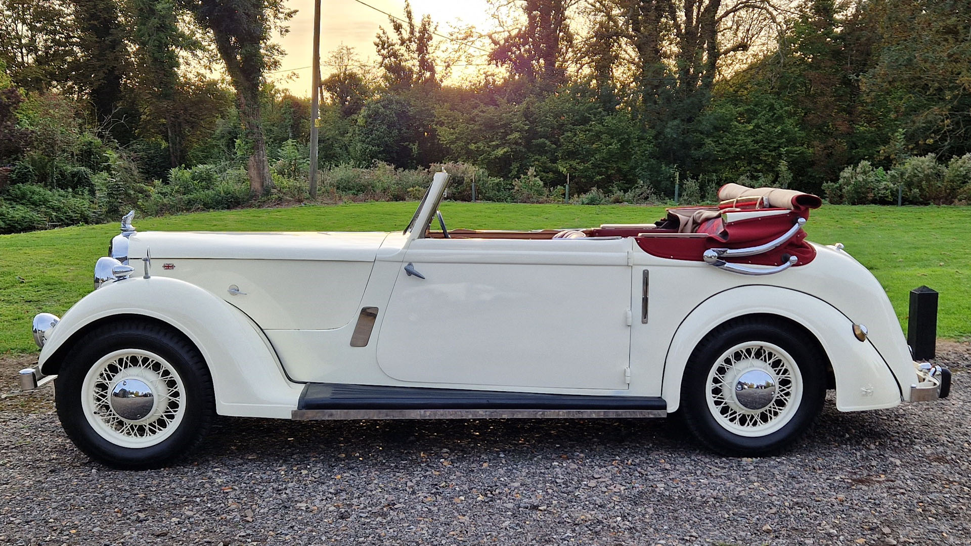 Left side view of ivory vintage Rover Tickford Drop Head Coupe with soft top roof open