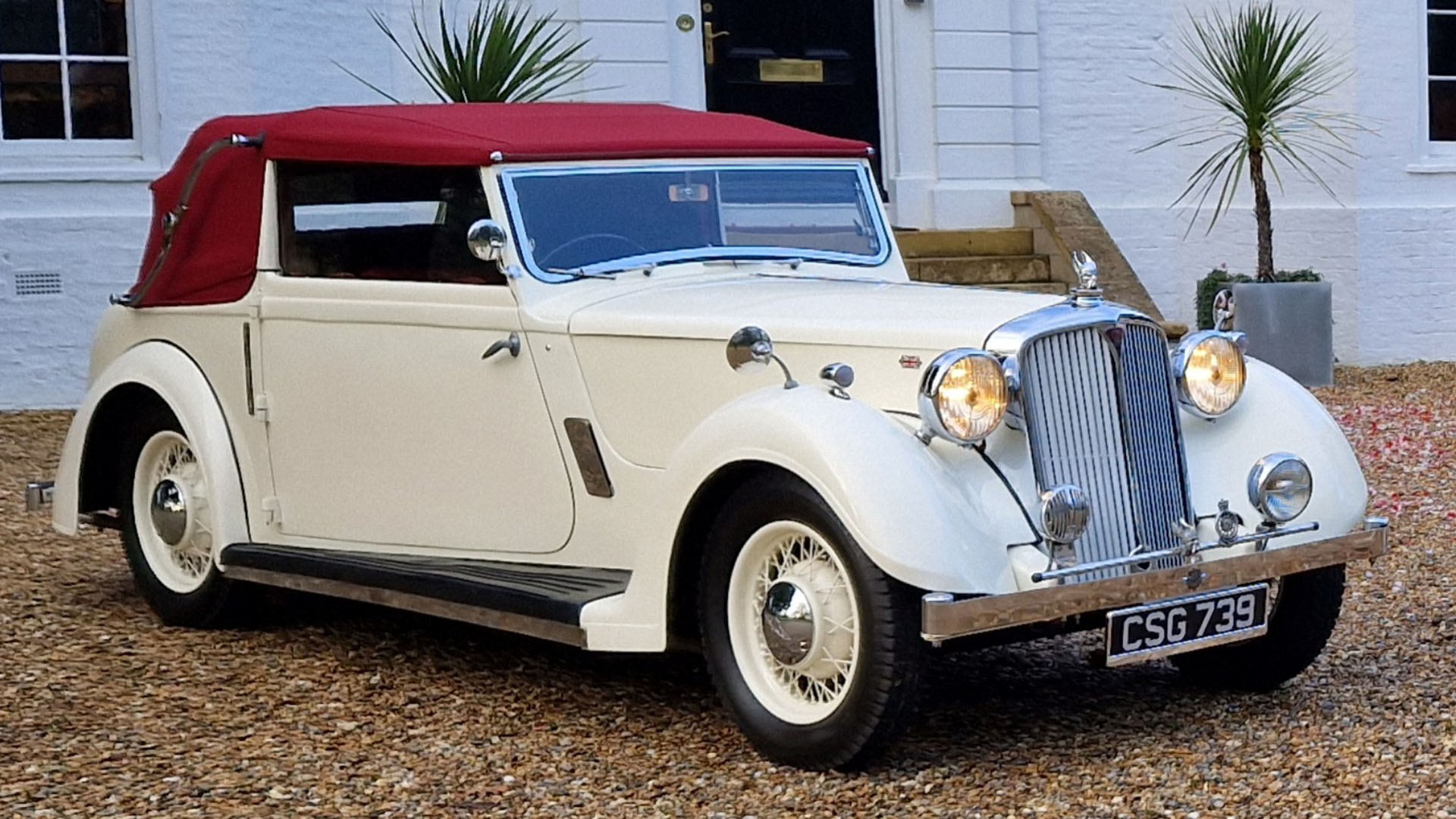 vintage Rover Tickford in Old English White with Burgundy soft top roof