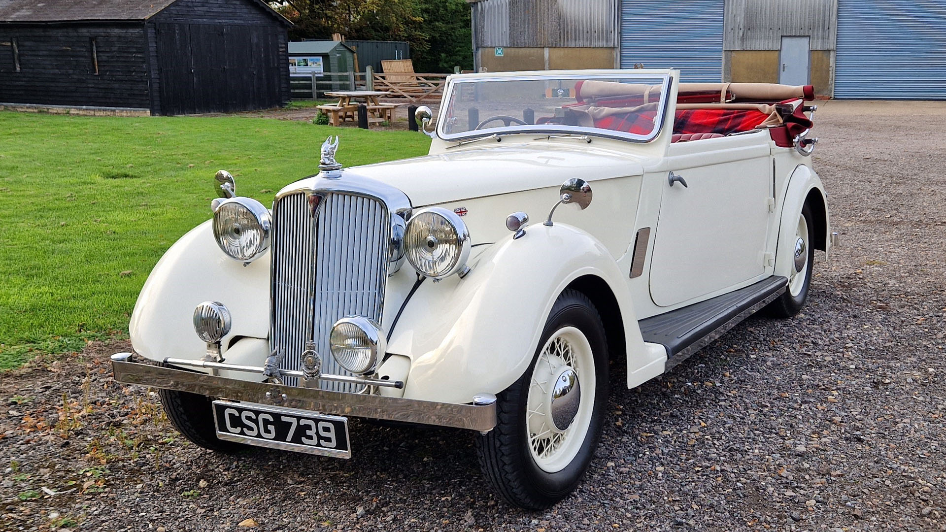 ivory vintage Rover Tickford with convertible roof open