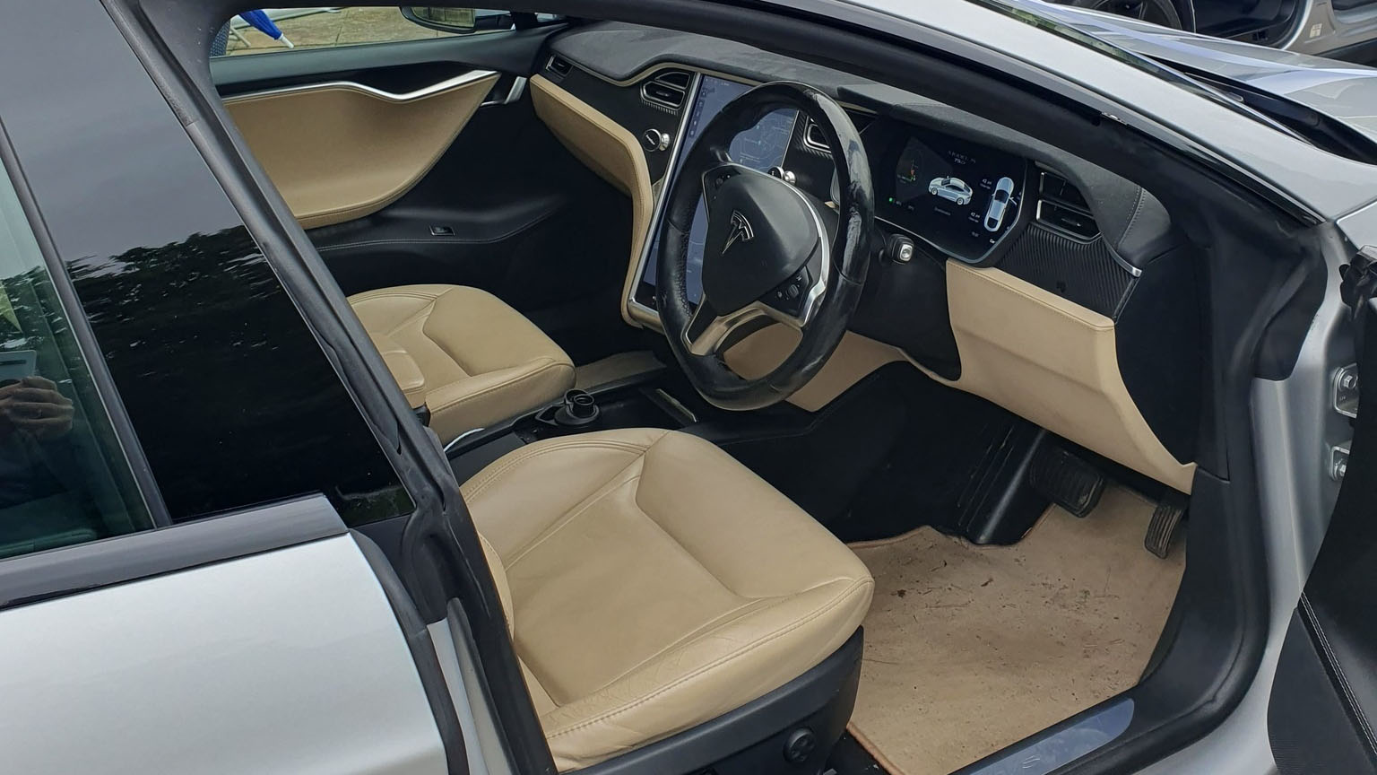 Front seats in cream leather inside Silver Tesla S.