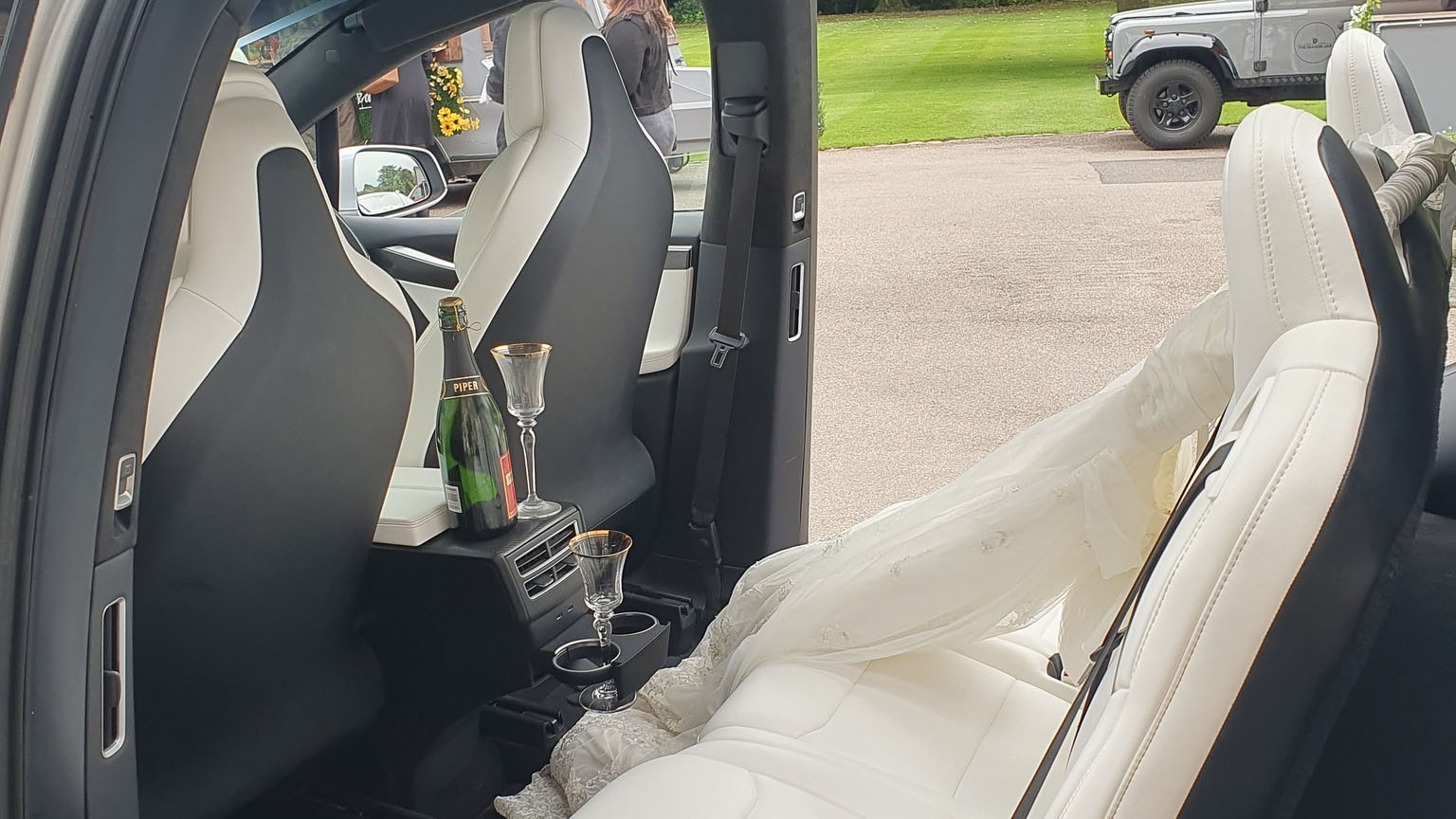 Rear interior cream seats inside Tesla X