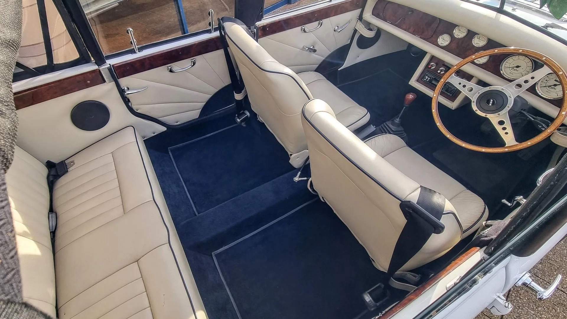 Aerial view of Beauford interior with cream leather interior and blue carpet