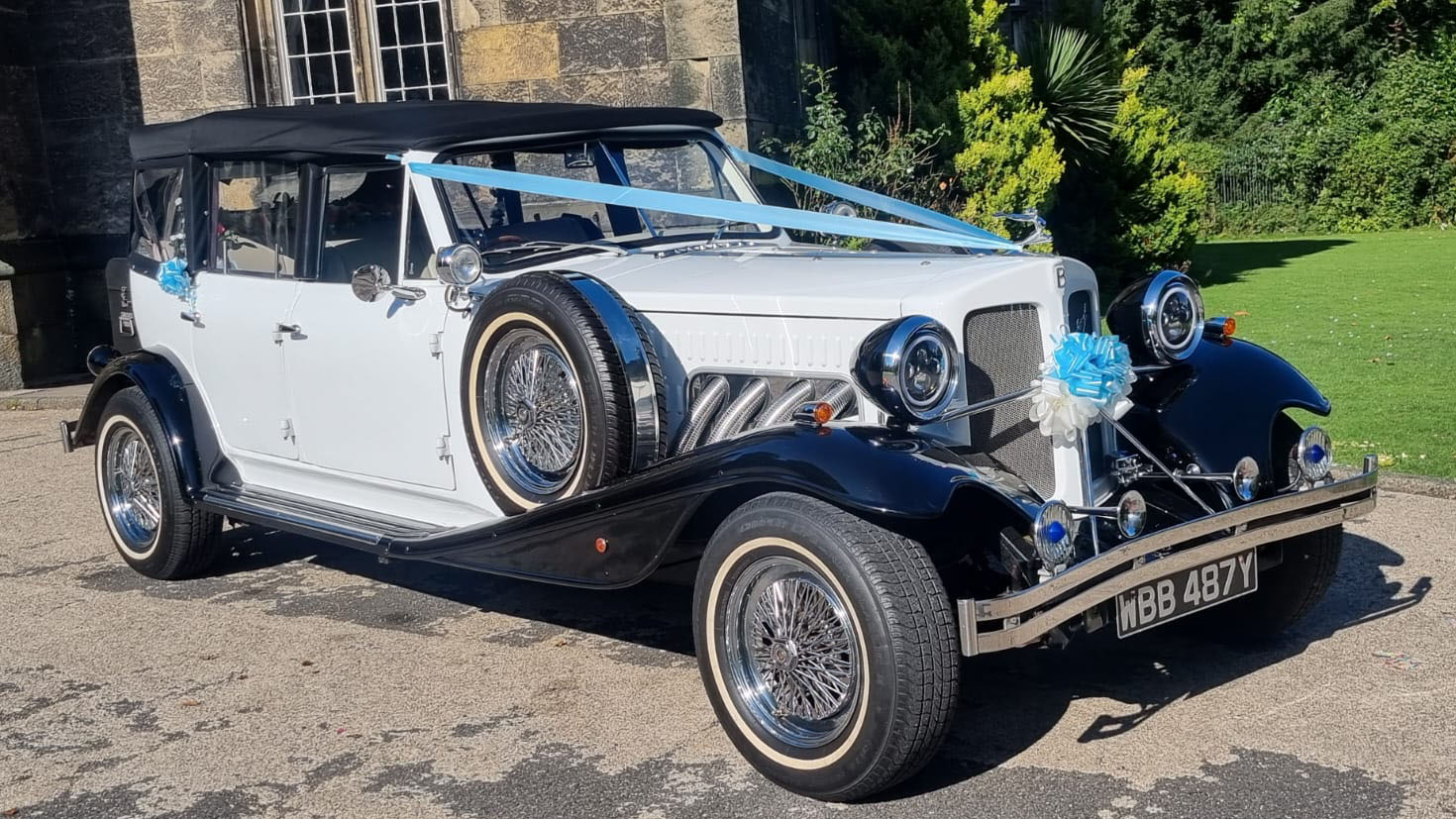 Vintage Beauford in black and white decorated with light blue ribbons