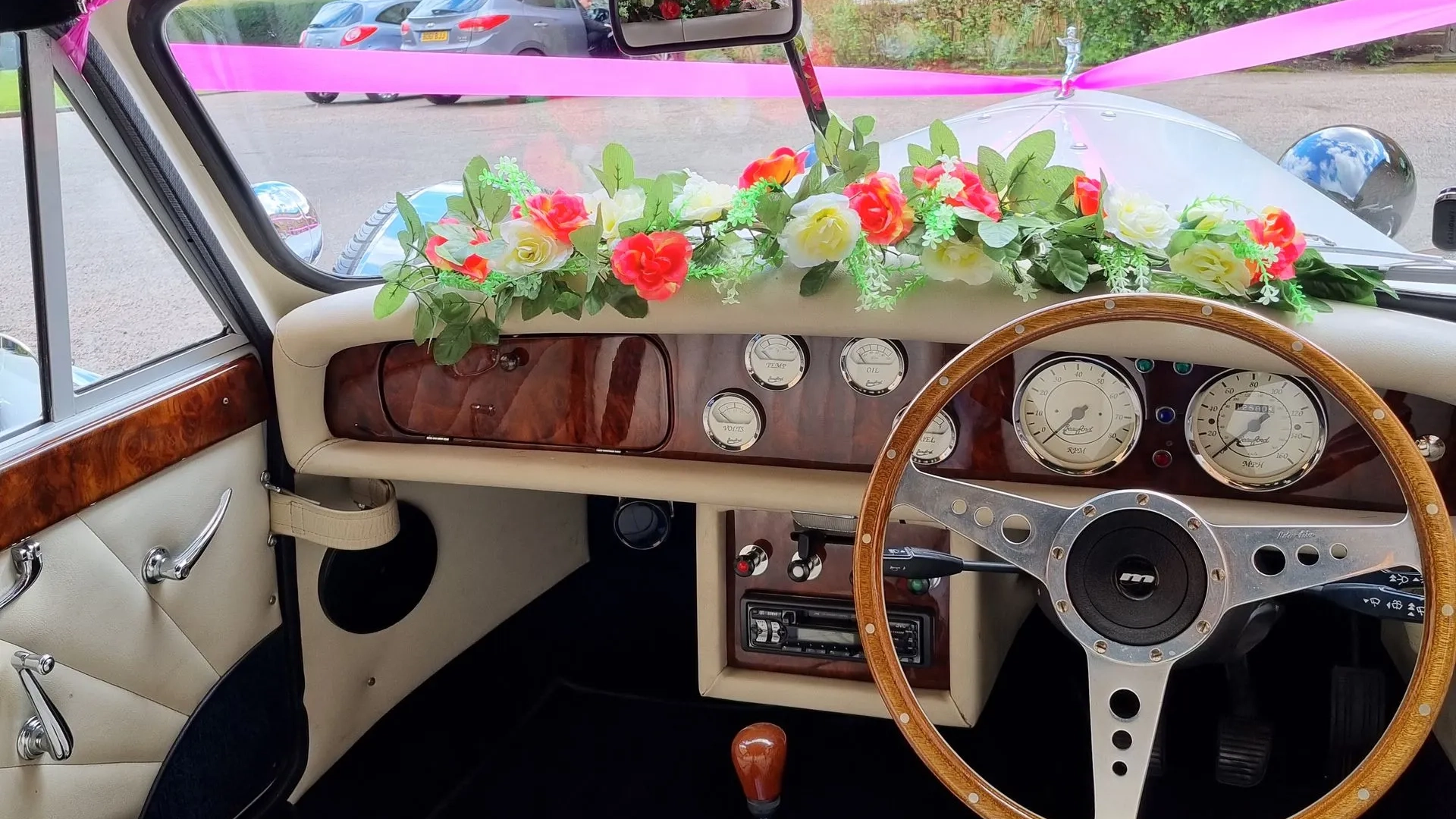 front interior wooden dashboard view decorated with wedding flowers