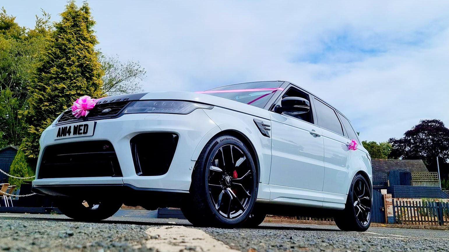 Black Alloy wheels on a white range rover