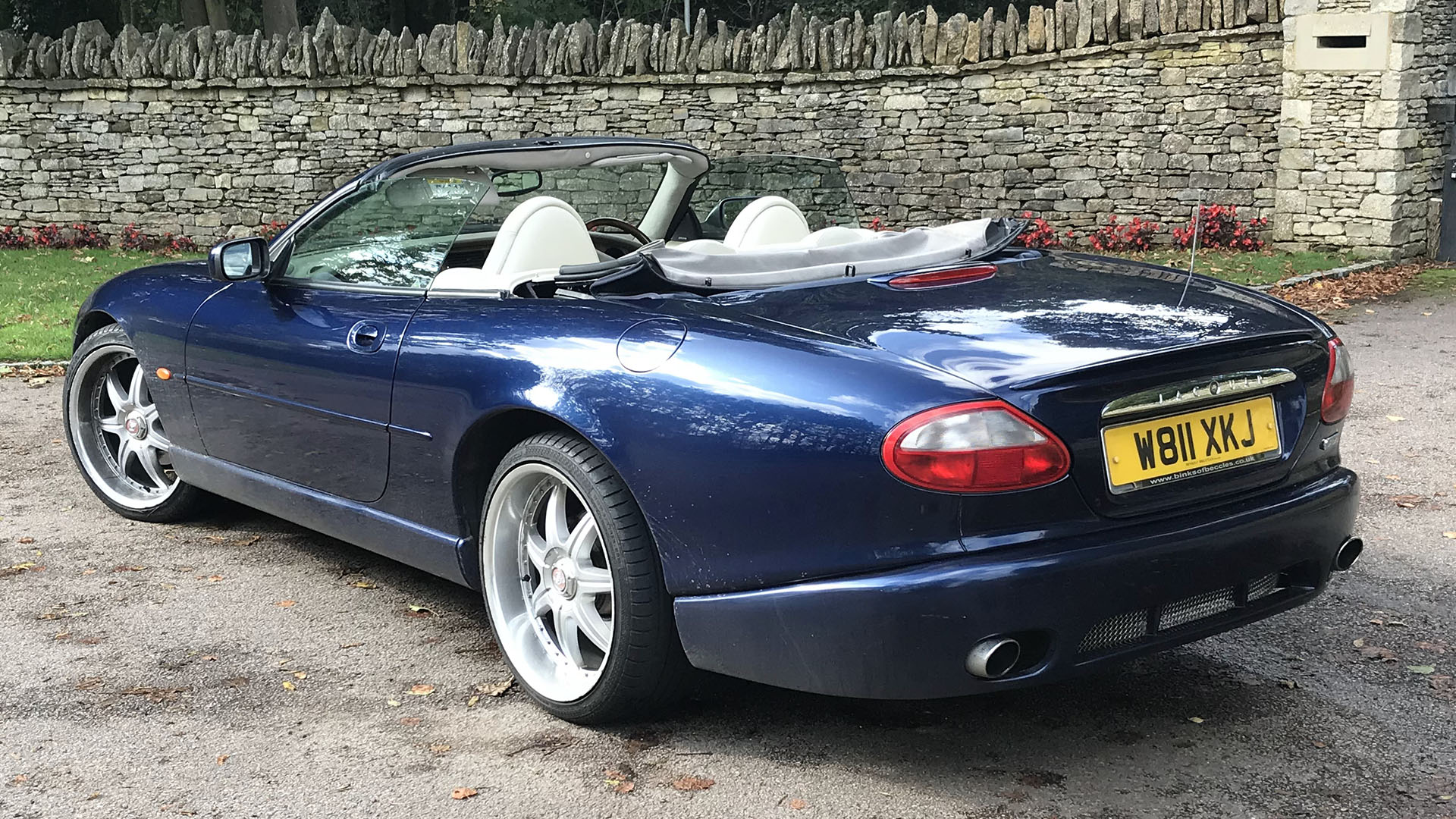 rear view of Jaguar XKR with convertible roof down