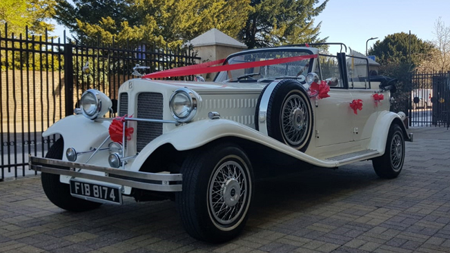 Beauford Convertible in cream with red ribbons and bows