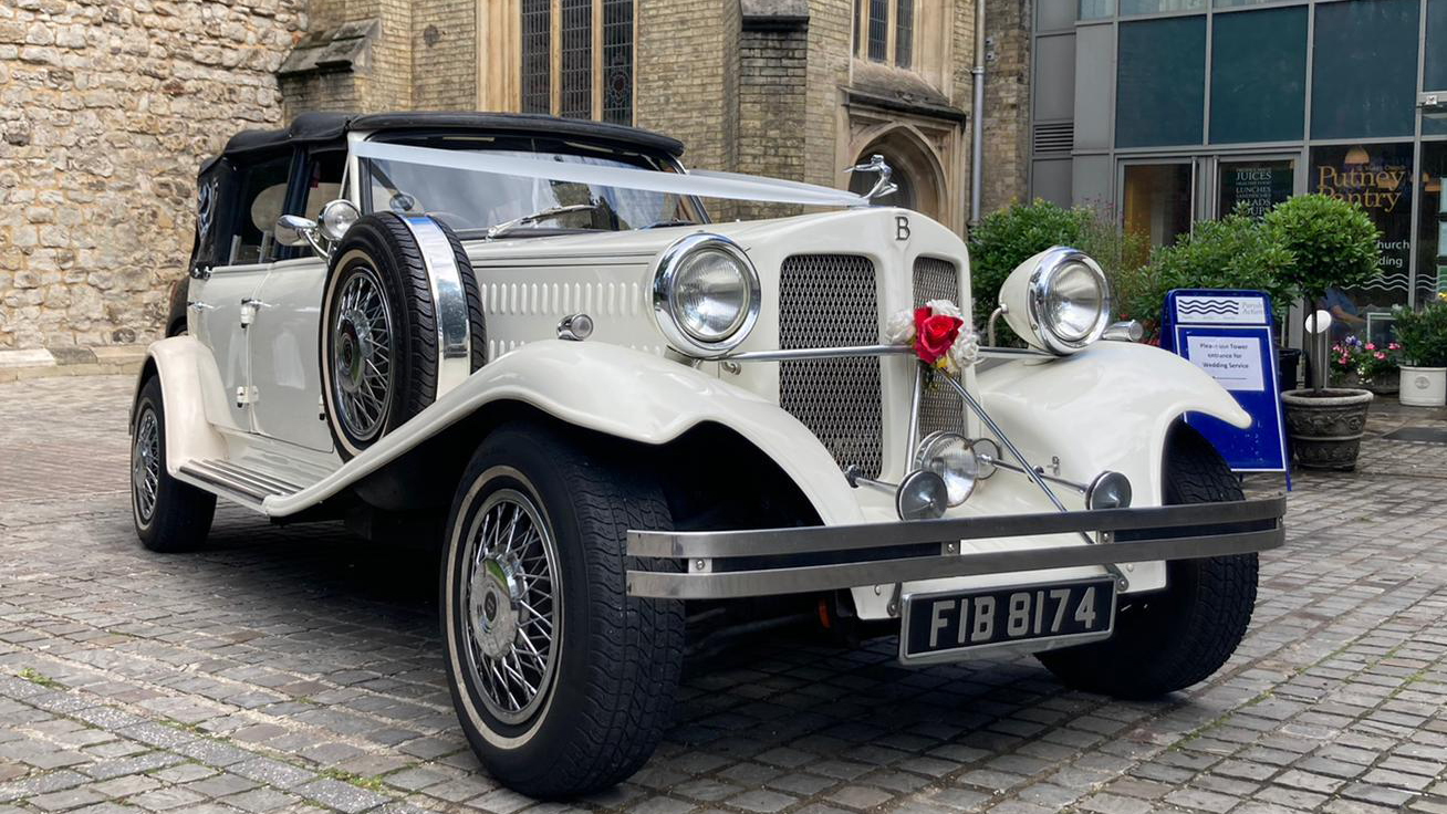 Vintage Beauford Wedding Car Hire dressed with white ribbons