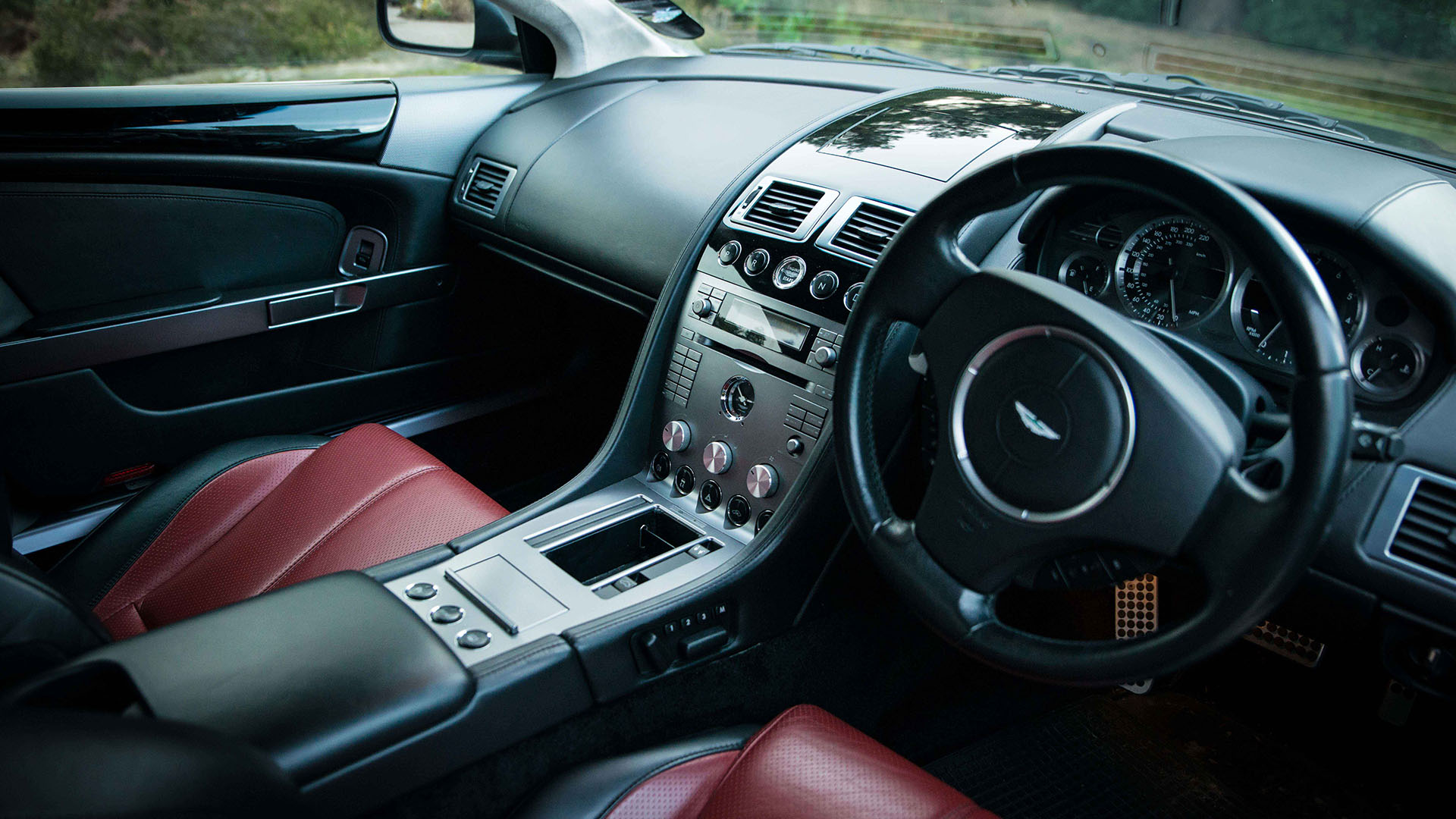 Black and Burgundy interior inside Aston Martin DB9