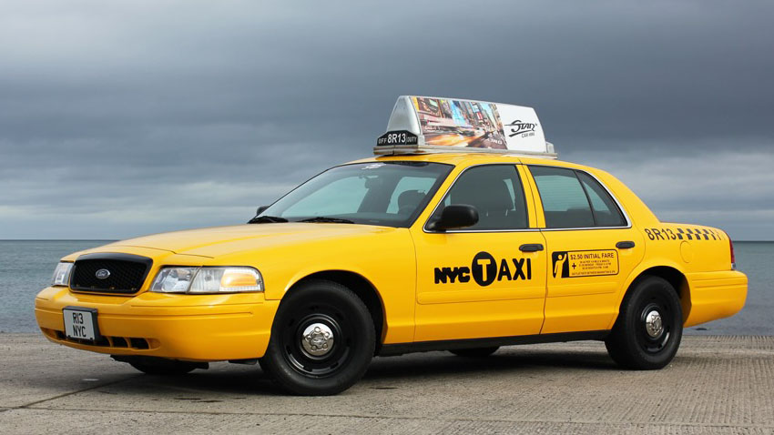 American New York City Yellow Cab with advertising panel on top of the roof