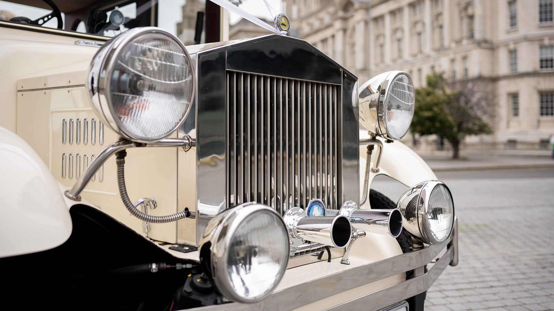 Close-up front chrome grill with chrome headlights on Imperial car