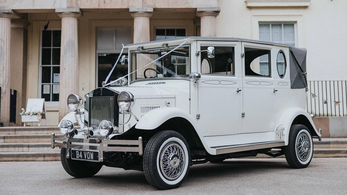 Imperial wedding car dressed with wedding ribbons parked in front of wedding venue in Liverpool