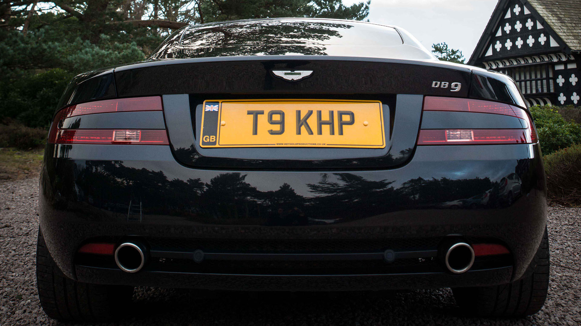 Full close-up rear view of black Aston Martin