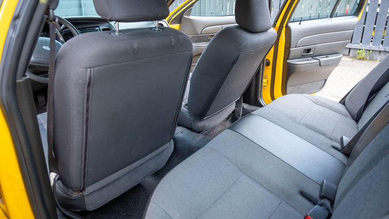 Rear interior Grey seats insiode Ford Crown Victoria Yellow Cab