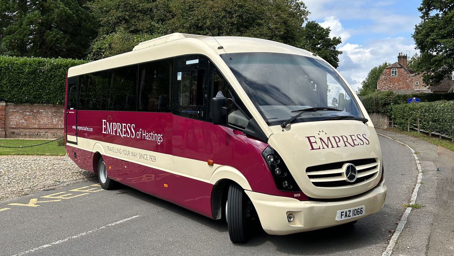 rioght side view Mercedes 33 Seater Bus in Burgundy and Beige colours