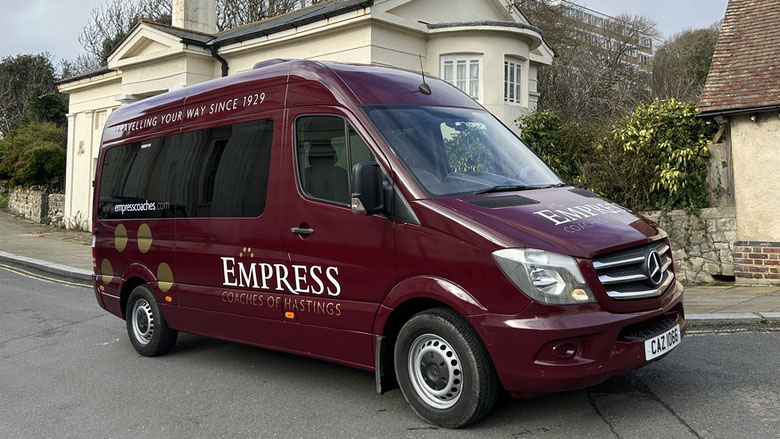 Left side view of Mercedes 12 Seater wedding Bus in Burgundy