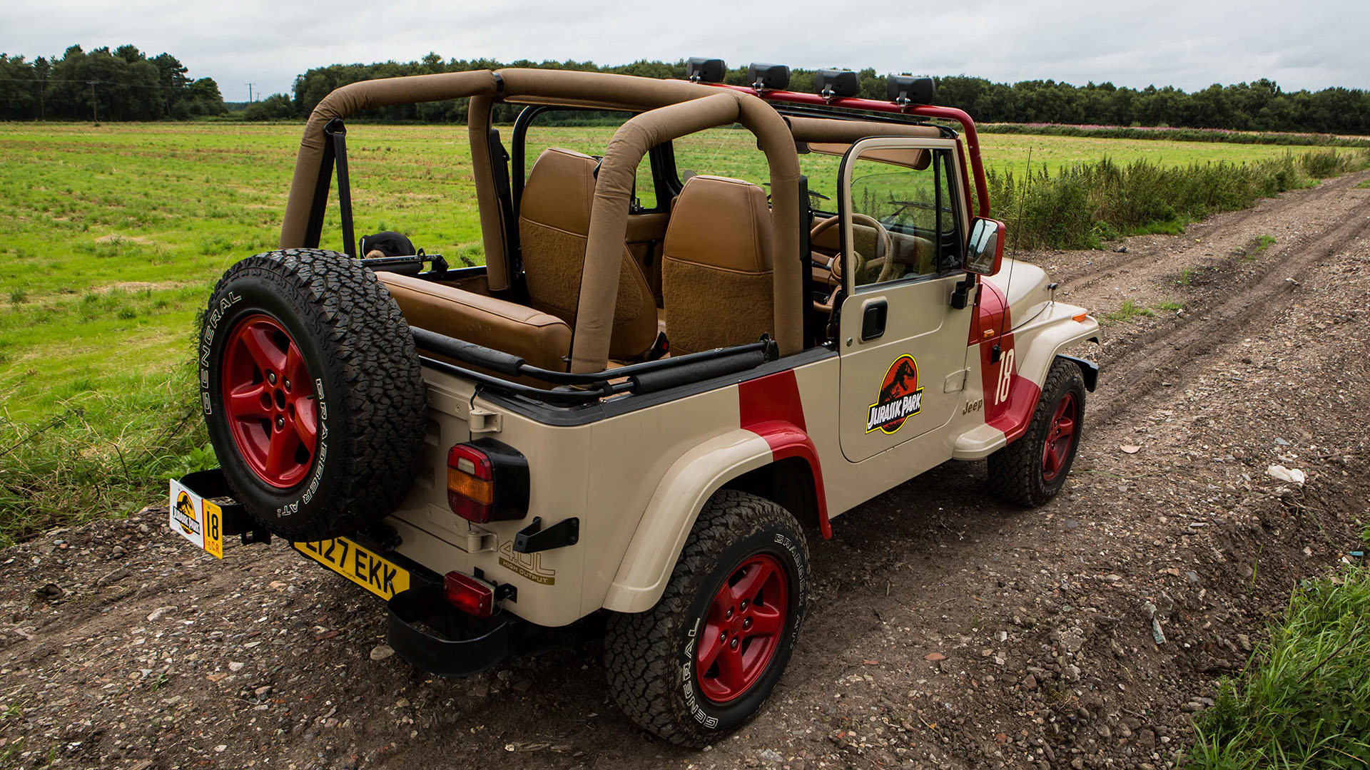 Rear view of Classic American Jeep Wrangler from Juirassic Park movie with canvas roof open