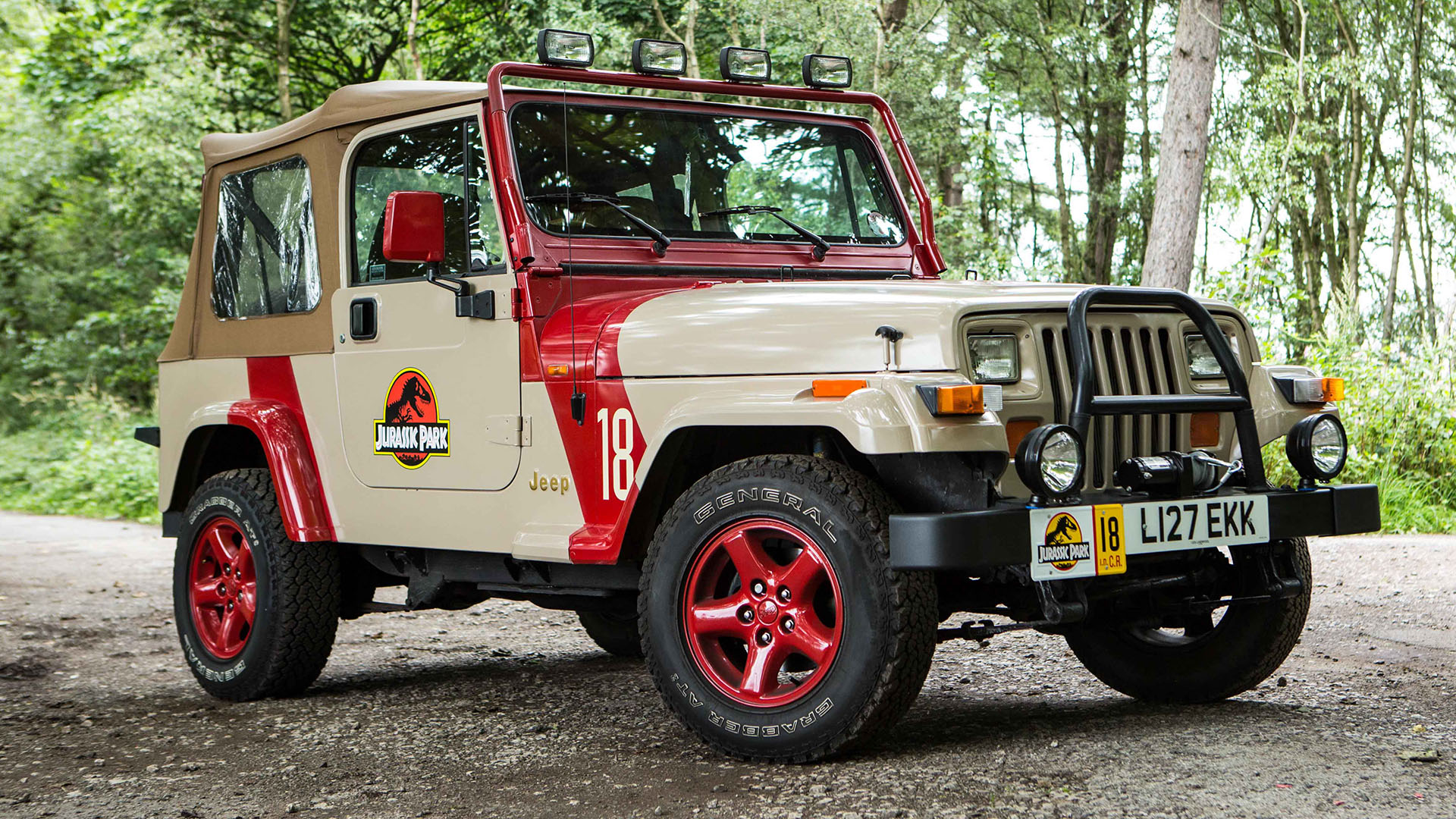 Beige Jeep with Jurassic Park theme decors and logos