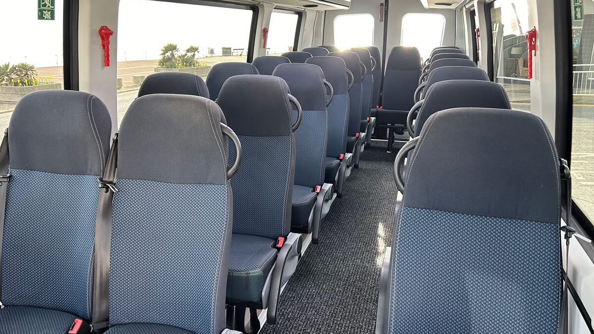 Silver and Blue interior seats inside Modern Coach