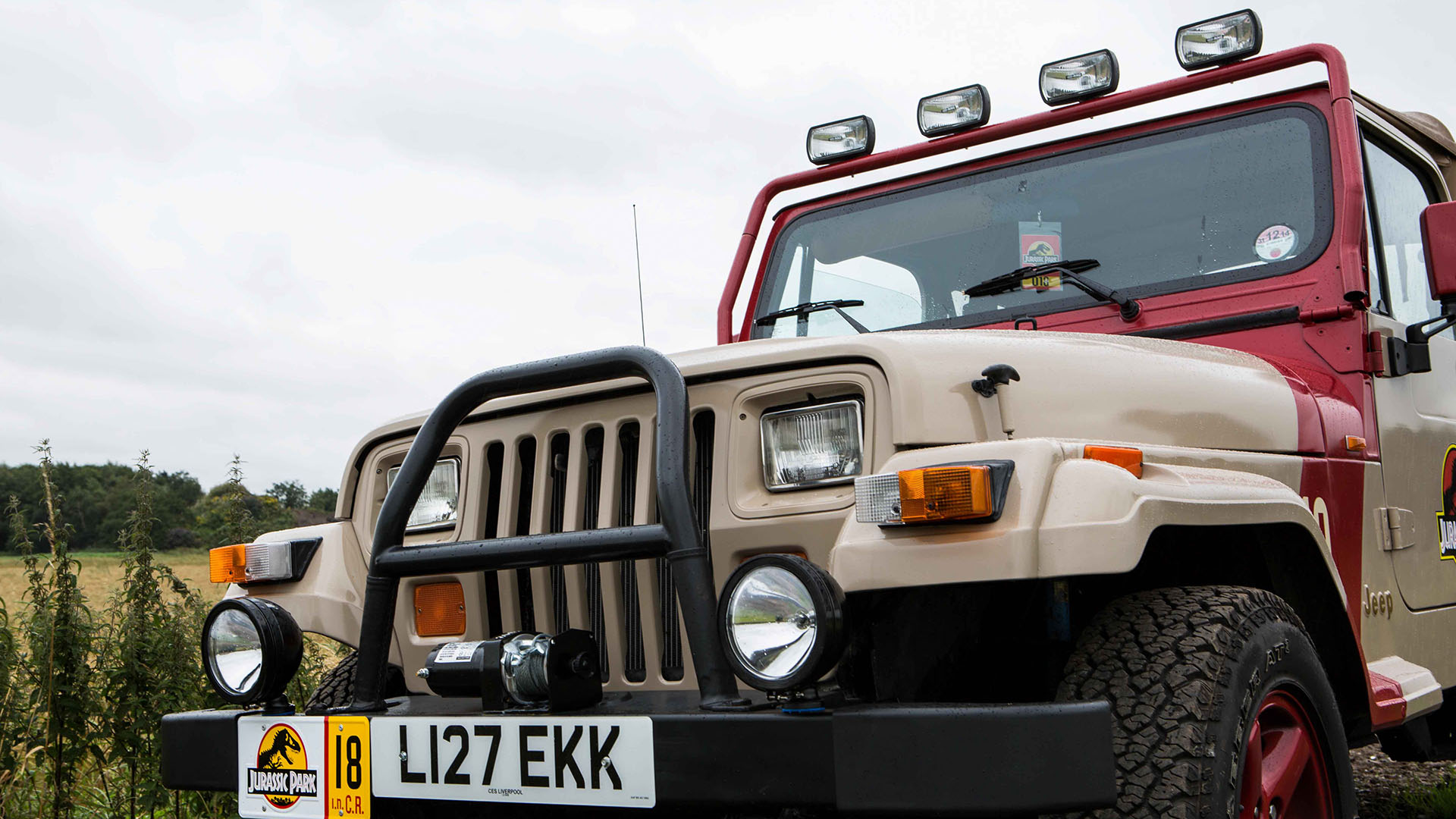 Close up from view of Jeep Wrangler with four spotlights on top of the driver's cabin