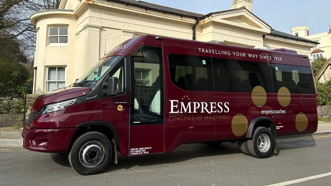 Left side view of Burgundy coach