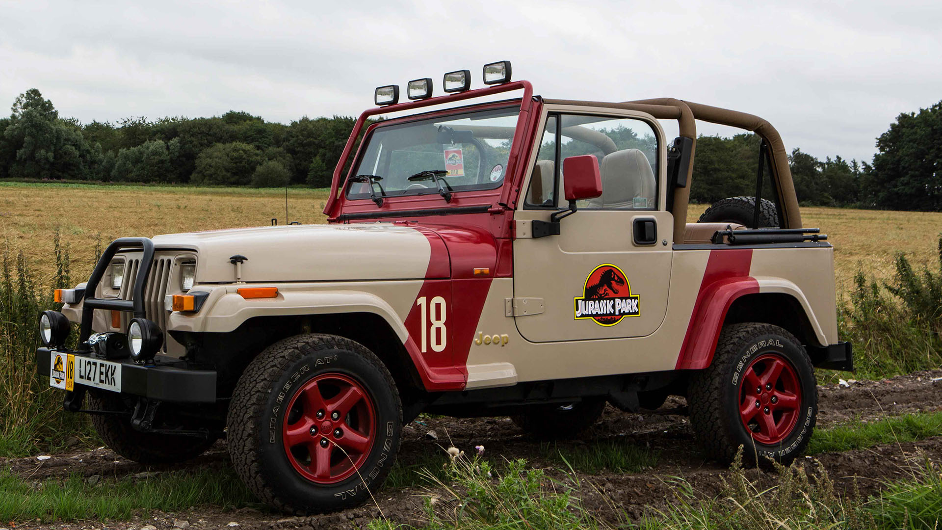 Left side view of Jeep Wrangler from Jurassic Park movie with canvas roof open