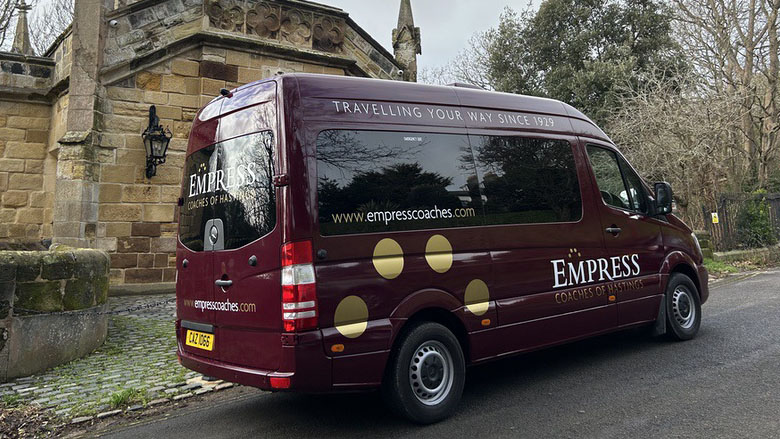 Rear viee of Burgundy Mercedes 12 Seater Bus with provacy rear windows