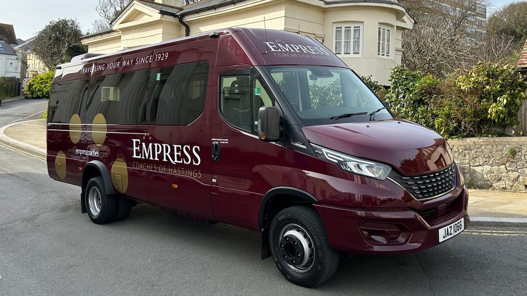 Front right side view of Burgundy 22-seat coach