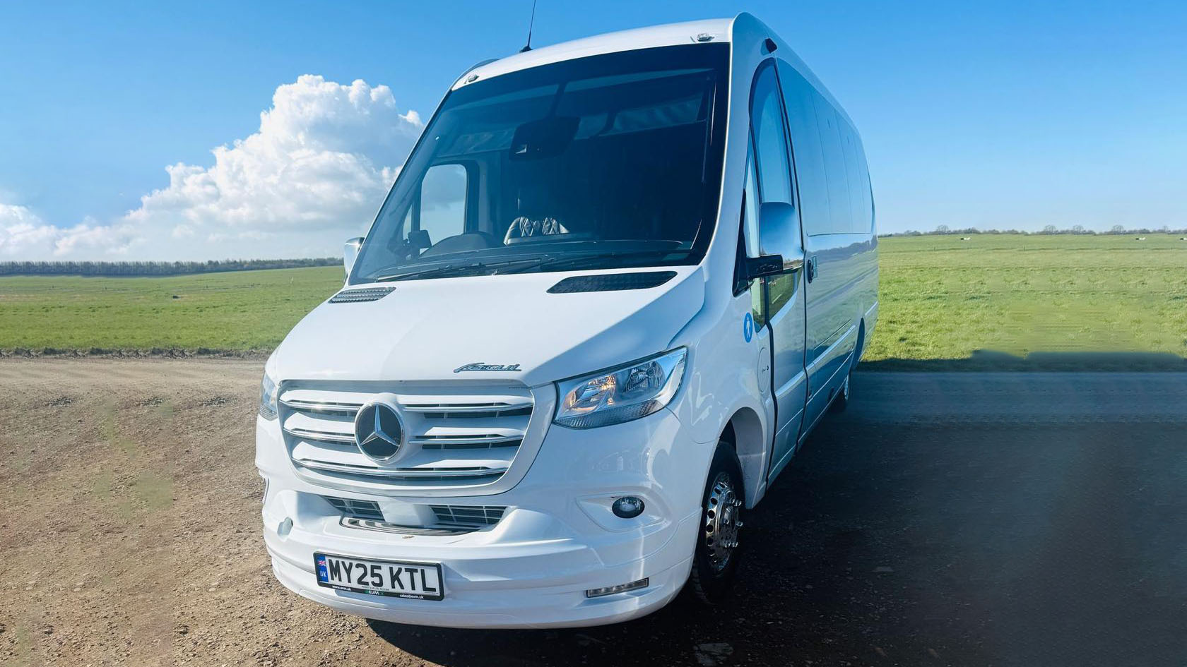 White Mercedes mini bus