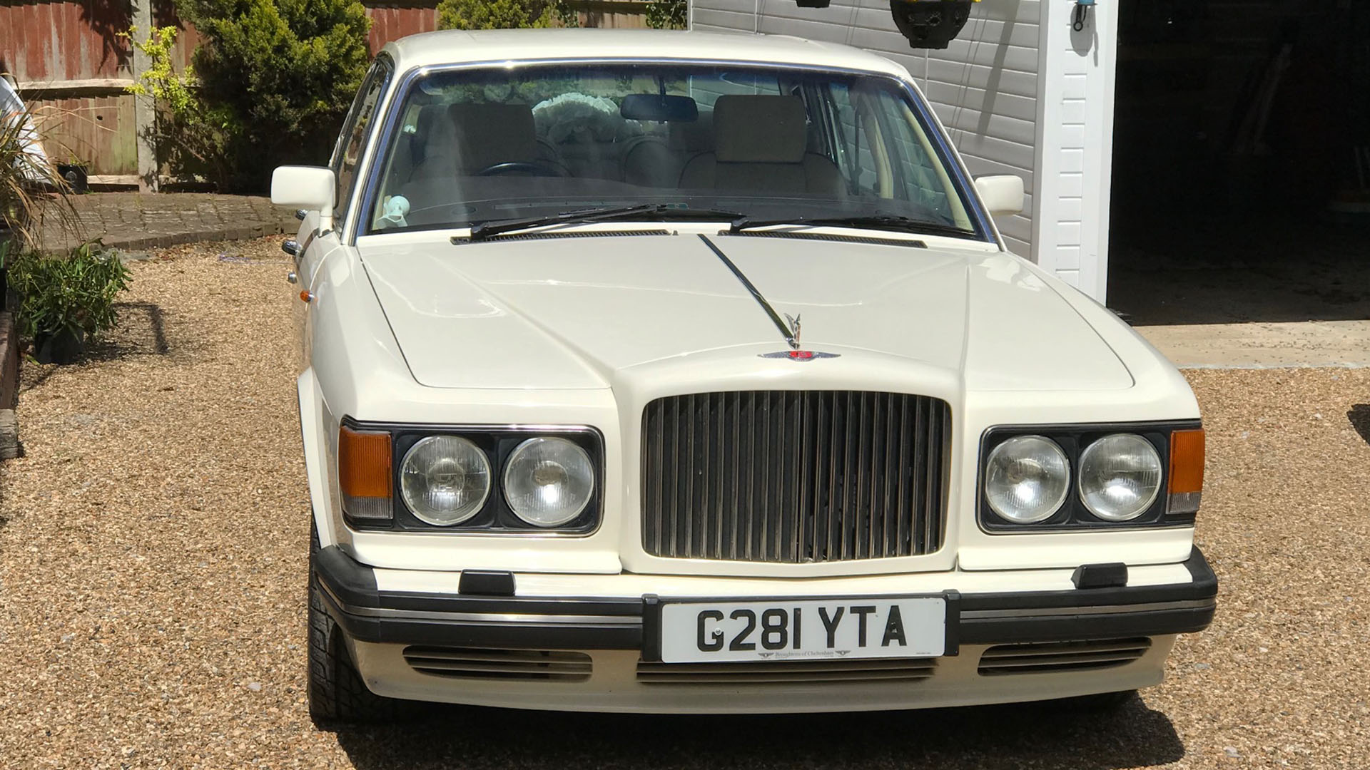 Full front view of Bentley Turbo R in Old English White with chrome grill