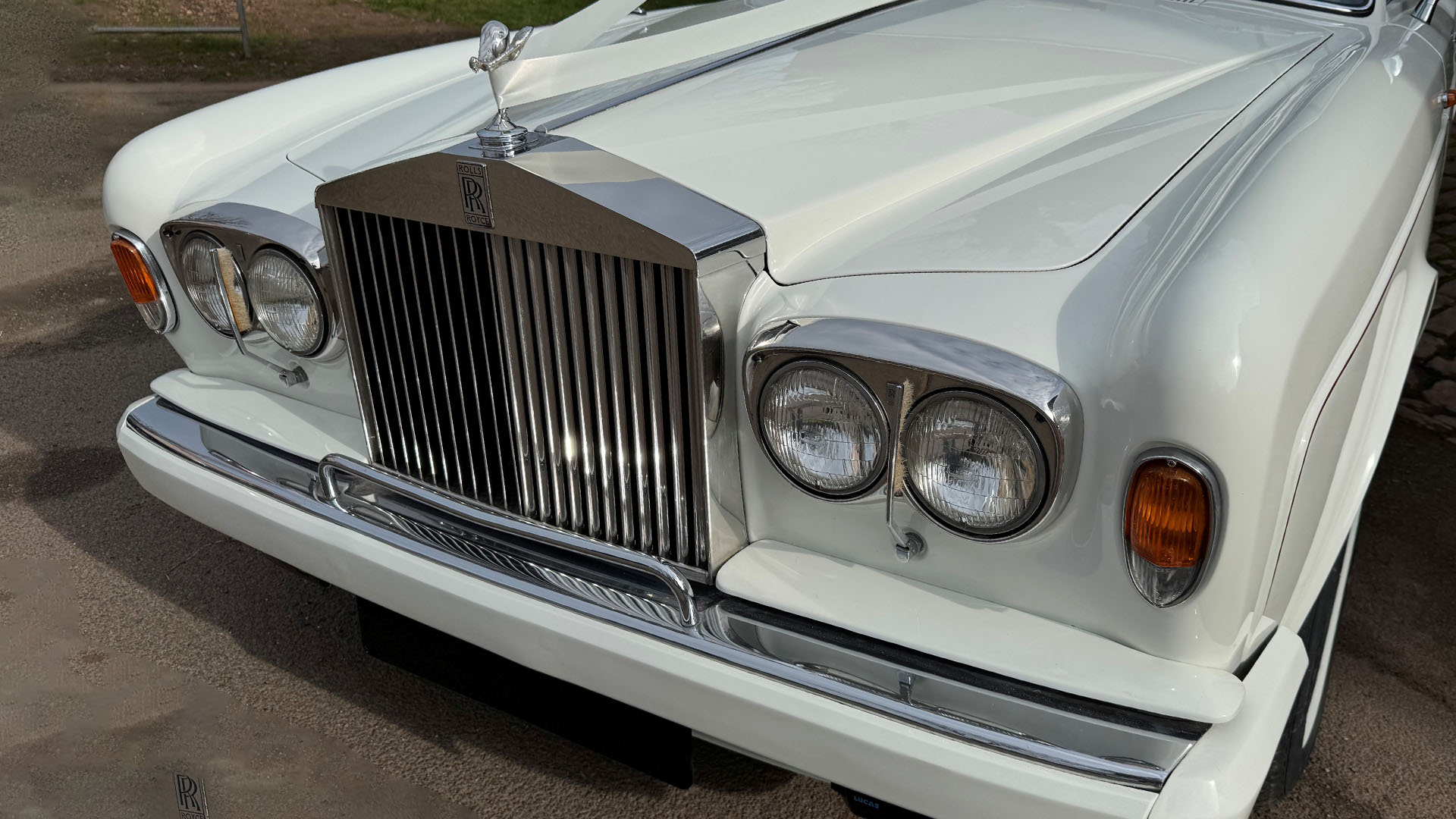 Front chrome grill view on White Classic Rolls-Royce