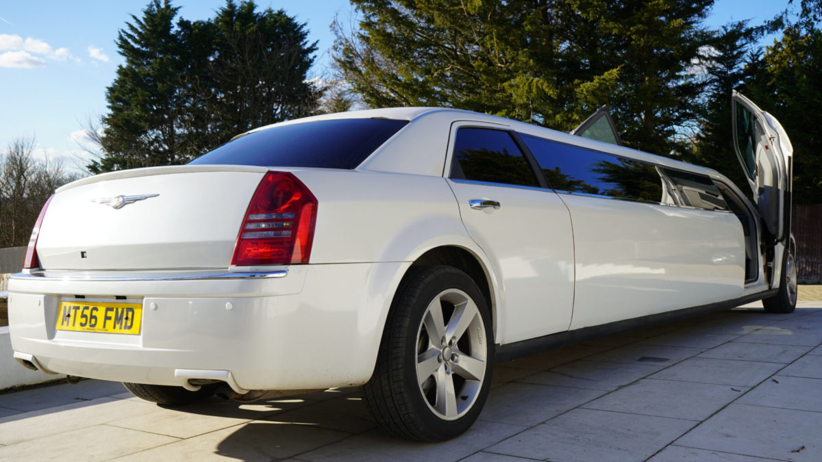 Rear view of white Chrysler 300c stretched limousine