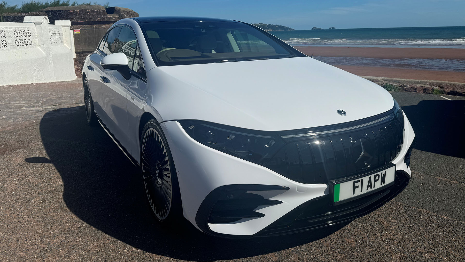 White Mercedes EQS with blak front grill