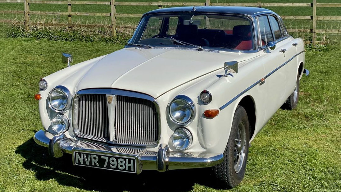 Front view of a classic Rover P5 Coupe in Cream with large chrome grill