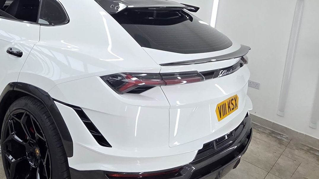 Rear view of White Lamborghini Urus