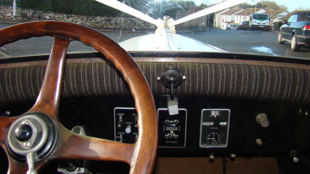 View of Bonnet dressed with white ribbon and bow from the driver's seat