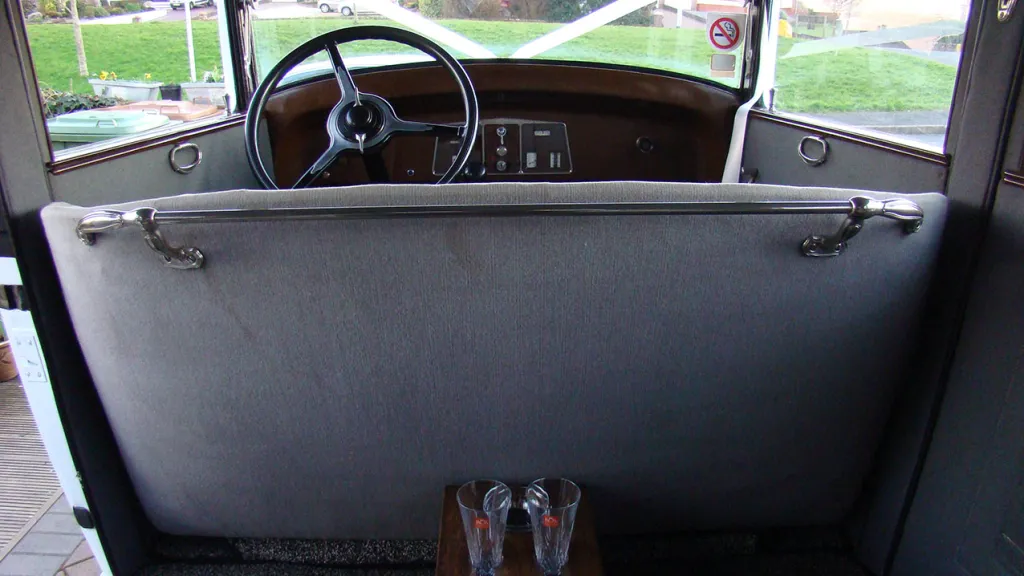 view of the front interior cabin taken from the rear seat