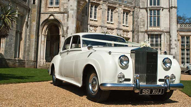 Right Front Side View of Rolls-Royce Silver Cloud in front of Highcliffe Castle in Dorset.