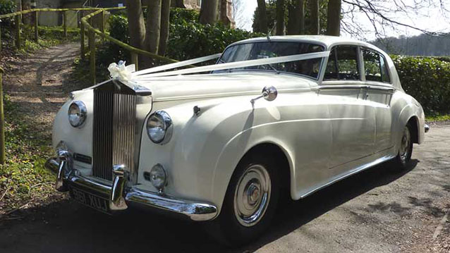 Front view showing the Rolls-royce grill, White Ribbon, Single headlight and chrmoe front bumper