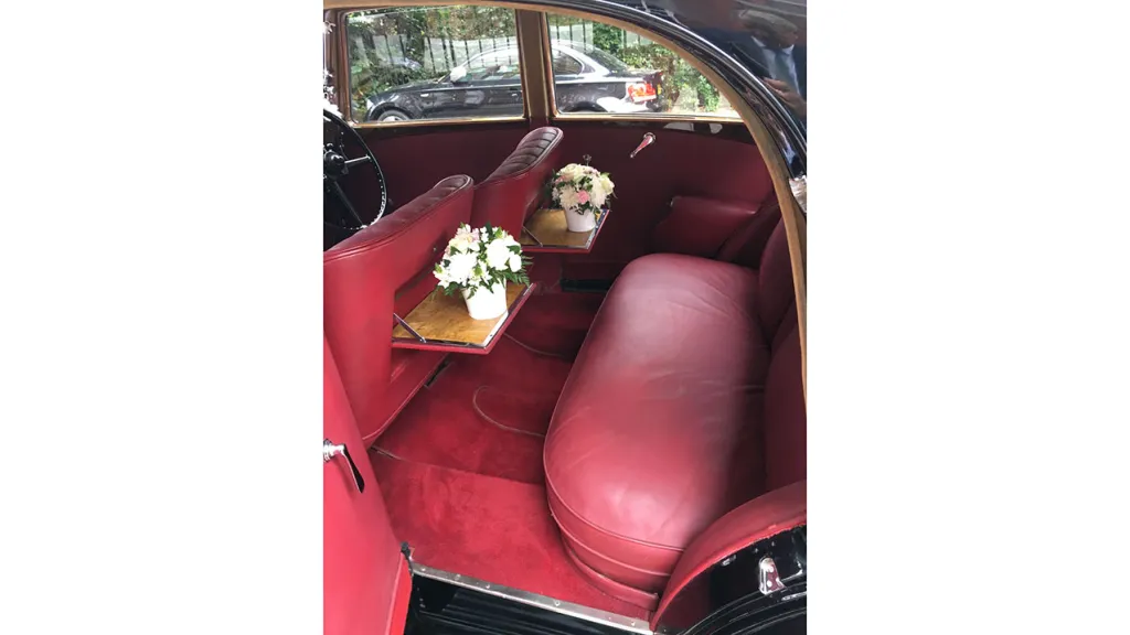 Rear interior of Rolls-Royce Phantom II Continental LWB with burgundy leather seat and carpet