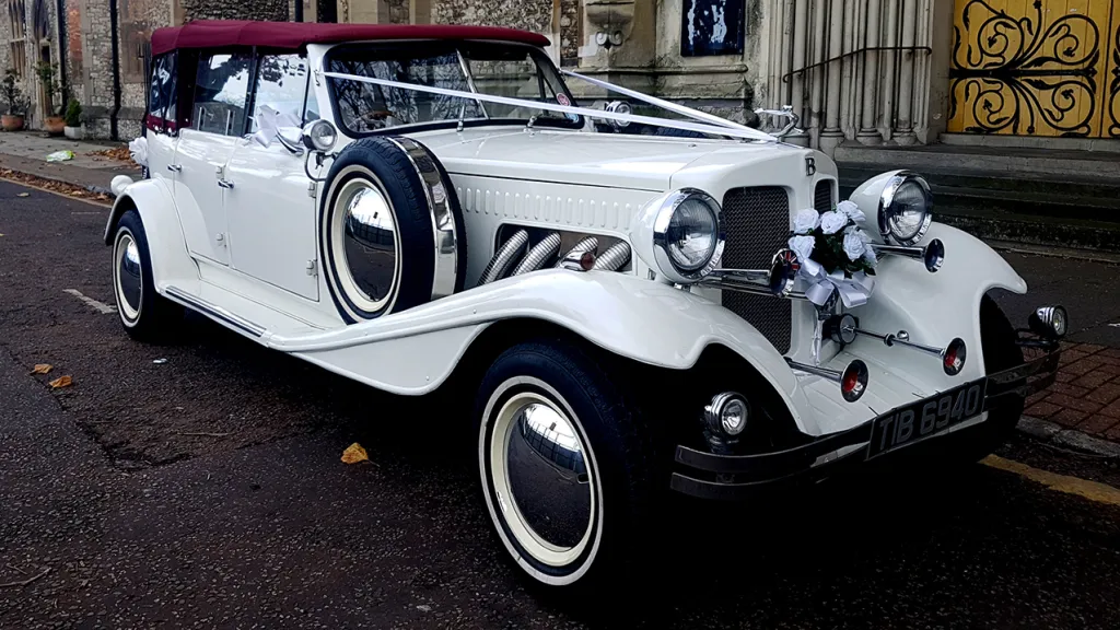 Beauford with 4 doors with white ribbons and Burgundy soft top roof