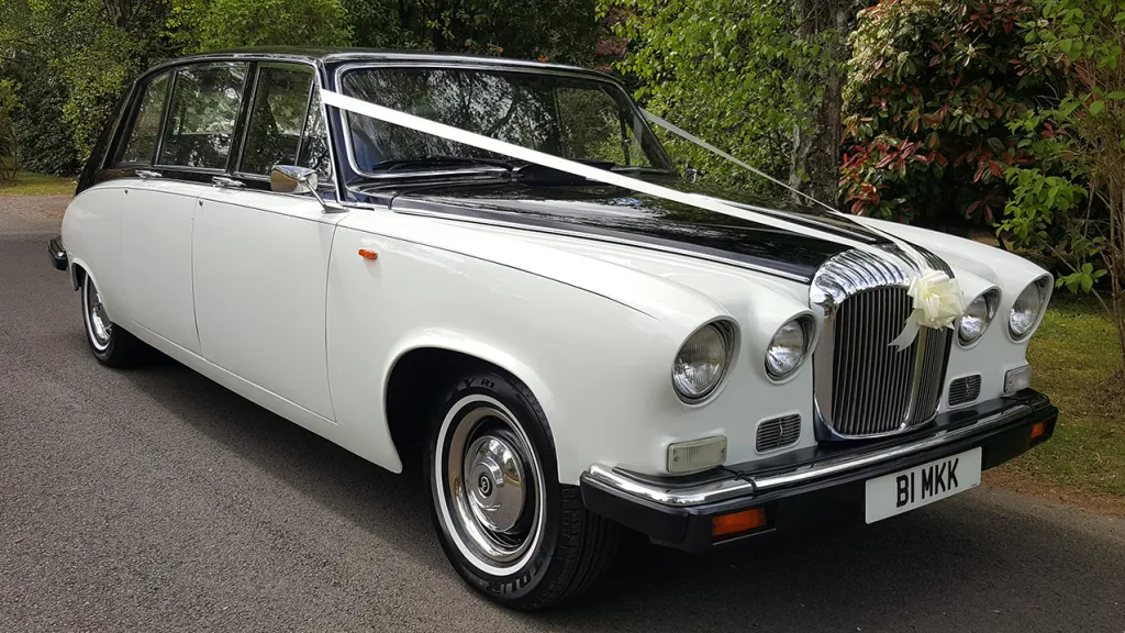 Classic Daimler in Black & Ivory decorated with White Ribbons across front bonnet.