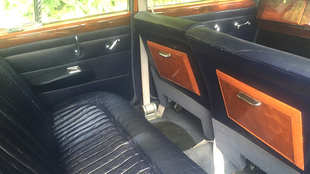 Dark Blue rear leather interior with polished wood picnic tables